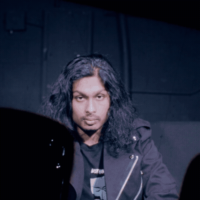 Man With Long Hair In Black Jacket Saying Nothing GIF
