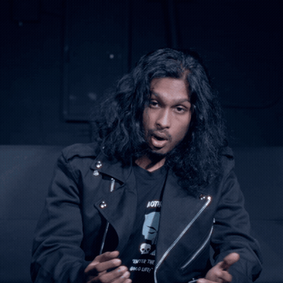 Man With Long Hair In Black Jacket Wearing Both T-Shirt GIF