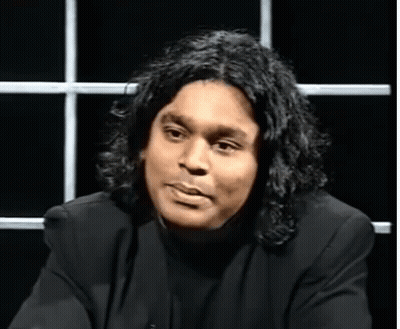 Man With Long Hair In Black Shirt GIF