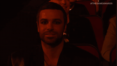 Man With Long Hair In Black Shirt Says Nothing GIF