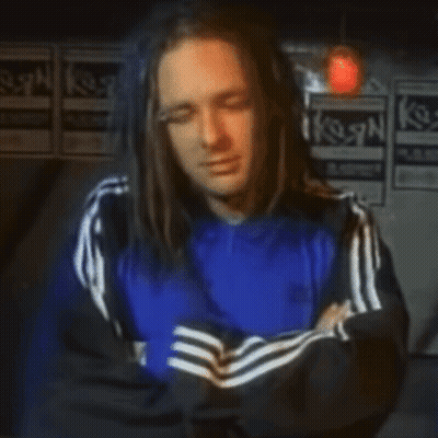 Man With Long Hair in Blue Adidas Jacket