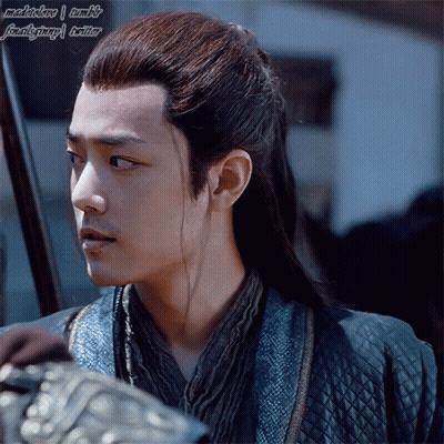 Man With Long Hair In Blue Jacket And Scarf GIF