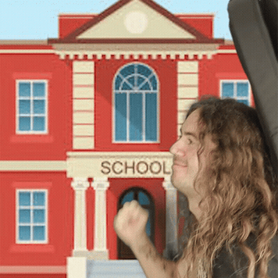Man With Long Hair In Front Of School GIF
