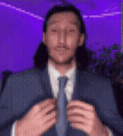 Man With Long Hair In Suit And Tie GIF