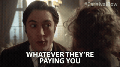 Man With Long Hair In Suit And Tie Making Funny Face GIF