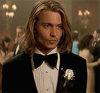 Man With Long Hair In Tuxedo And Bow Tie GIF