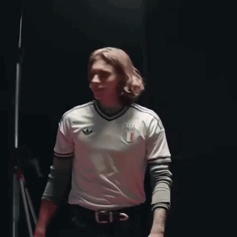 Man With Long Hair In White Adidas Shirt GIF
