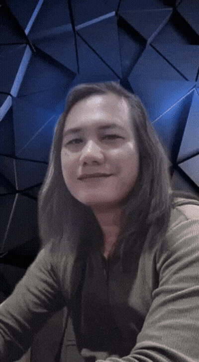 Man With Long Hair Looking At Camera Blue Background GIF