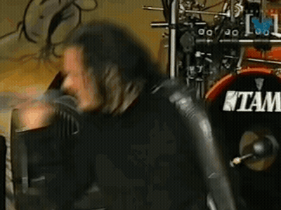Man With Long Hair Playing Drums Saying Tam GIF