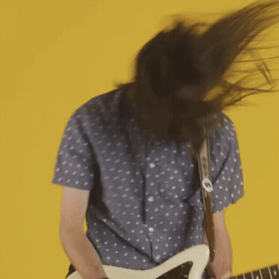 Man With Long Hair Playing Guitar GIF