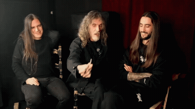 Man With Long Hair Pointing At Camera Wearing Slayer Shirt GIF