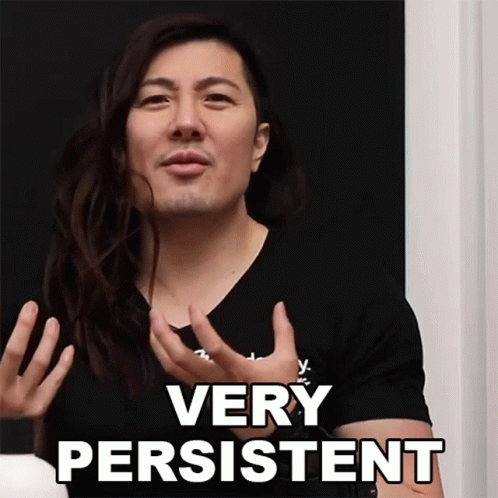 Man With Long Hair Says Very Persistent In Black Shirt GIF