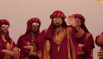 Man With Long Hair Sitting Next To Another Man GIF