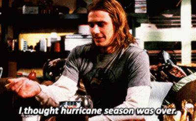 Man With Long Hair Sitting On Couch Says I Thought Hurricane Season Was Over GIF