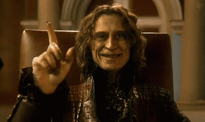 Man With Long Hair Sitting With Finger Up GIF