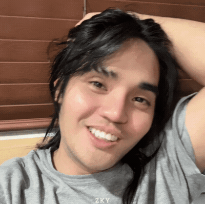 Man With Long Hair Smiling Shirt Says Zky GIF