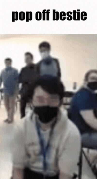 Man With Mask And Backpack On Head In Classroom GIF