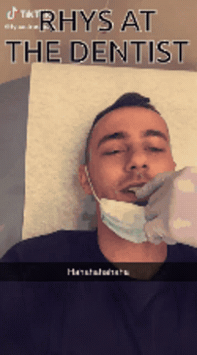 Man With Mask Getting Teeth Checked By Dentist GIF