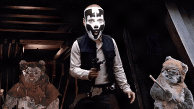Man With Mask Holding Gun Next To Ewok Bears GIF