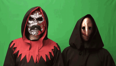 Man With Mask Next To Man In Black Robe GIF