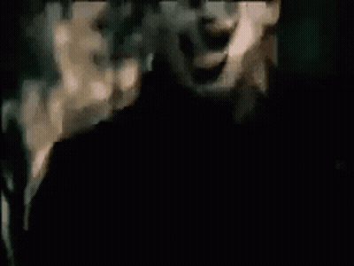 Man With Mask Screaming In Dark Room GIF