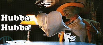 Man With Mask Sitting At Table With Lamp Saying Hubba Hubba GIF