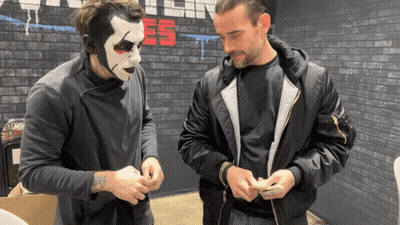 Man With Mask Talking To Man In Black Jacket GIF