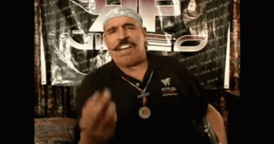 Man With Medal And Wrestlemania Shirt GIF