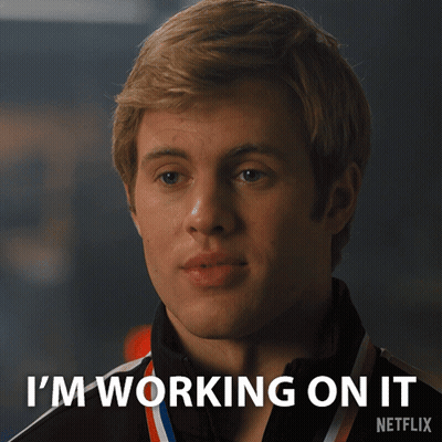 Man With Medal Says I'm Working On It GIF