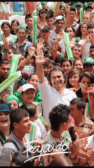 Man With Mejor Sign In Front Of Crowd GIF