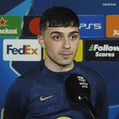 Man With Microphone In Front Of FedEx Sign GIF