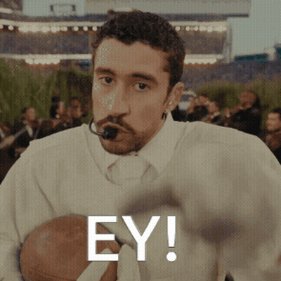Man With Microphone In Mouth Holding Football Ey GIF