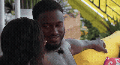 Man With Microphone Sitting Next To Woman GIF