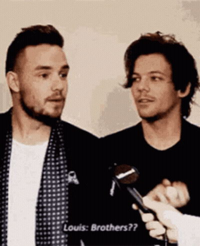 Man With Microphone Talking To Another Man GIF