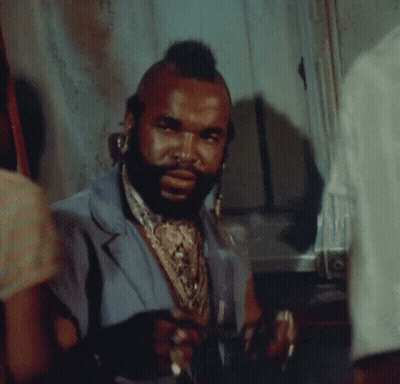 Man With Mohawk And Beard In Blue Vest GIF