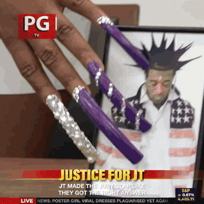 Man With Mohawk And Purple Nails On PG TV Screen GIF