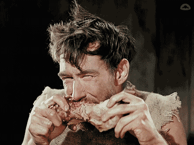Man With Mohawk Eating Meat GIF