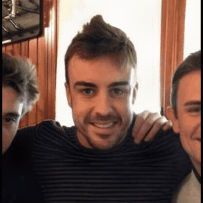 Man With Mohawk Smiling With Two Men GIF