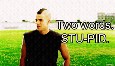 Man With Mohawk Standing In Field Saying Two Words Stupid GIF
