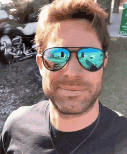 Man With Motorcycle Reflection In Sunglasses GIF