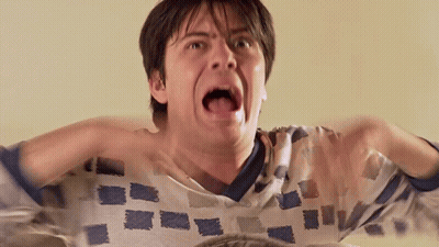 Man With Mouth Open Hands Behind Head GIF