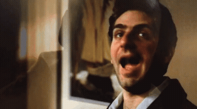 Man With Mouth Open In Front Of Mirror GIF