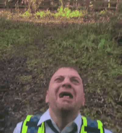 Man With Mouth Open In Yellow Vest GIF