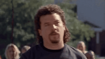 Man With Mullet And Beard In Crowd GIF