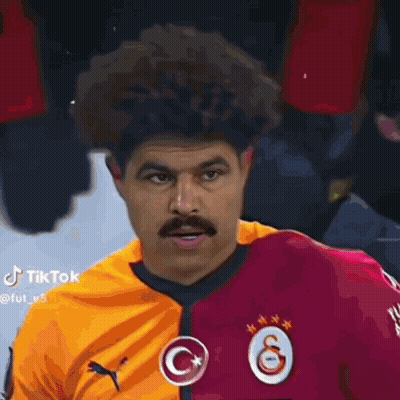 Man With Mustache And Curly Hair Wearing Puma Jersey GIF