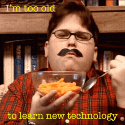 Man With Mustache And Glasses Eating Cheese Puffs GIF