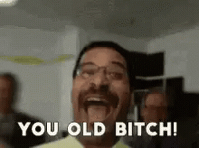 Man With Mustache And Glasses Laughing Saying You Old Bitch GIF