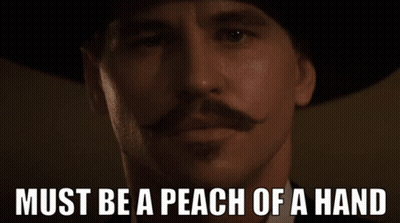 Man With Mustache And Hat Saying Must Be A Peach Of A Hand GIF