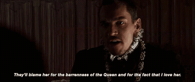 Man With Mustache And Necklace Says They'll Blame Her For The Barredness Of The Queen GIF