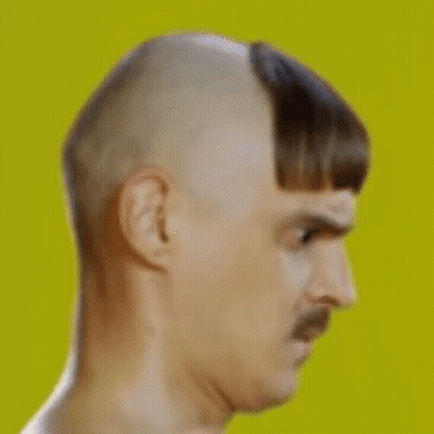 Man With Mustache And Shaved Head Making Funny Face GIF